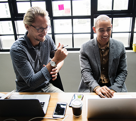 two businessman in trendy office