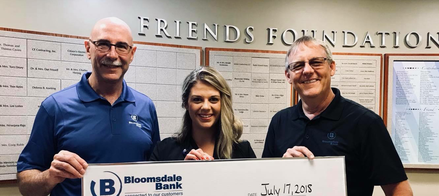 Bloomsdale Bank employees with check for hospital