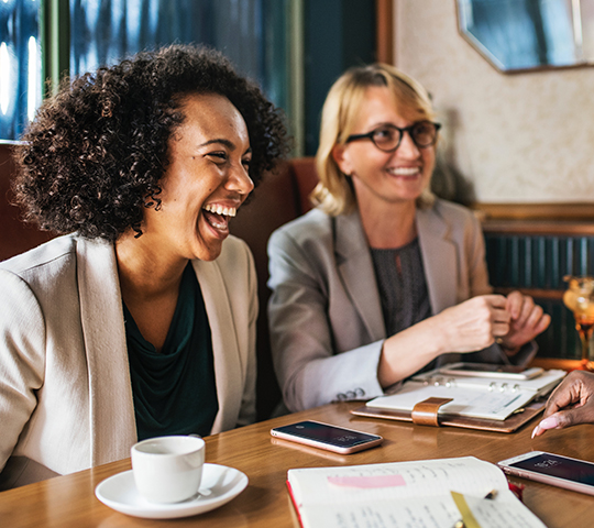 happy women at business meeting in coffee shop